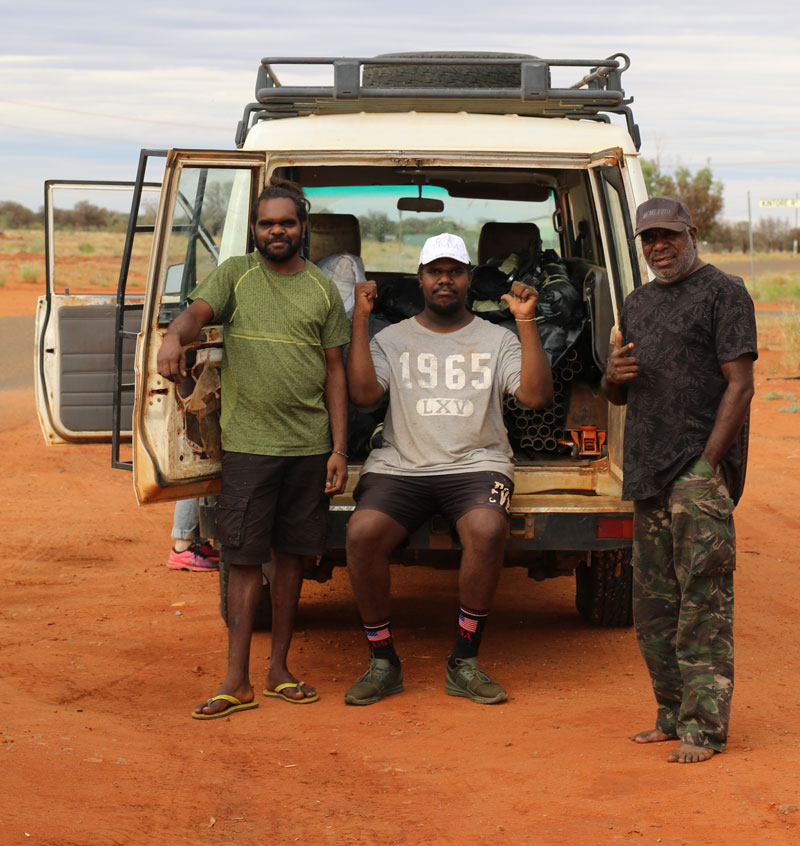 Arts worker Selwyn Nacambala, artist Jayquin Nelson, chairperson Watson Corby with Papunya Tjupi’s troopy packed and ready to go with artworks ahead of the art centre temporarily closing on 10 April. Courtesy Papunya Tjupi Arts 