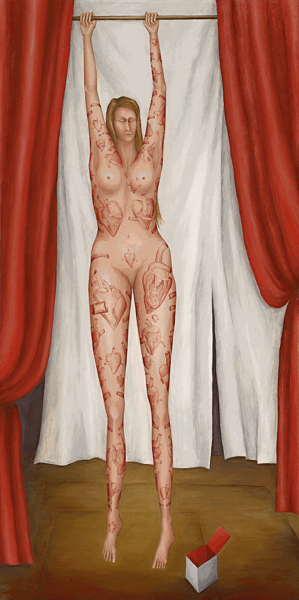 Standing nude woman with tattoos in front of red curtain.