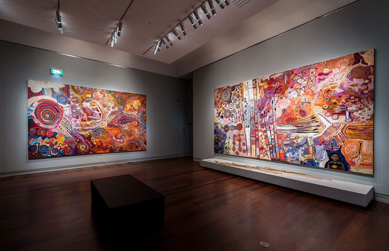 Men's and Women's paintings from APY Lands, installation view, Tarnanthi
