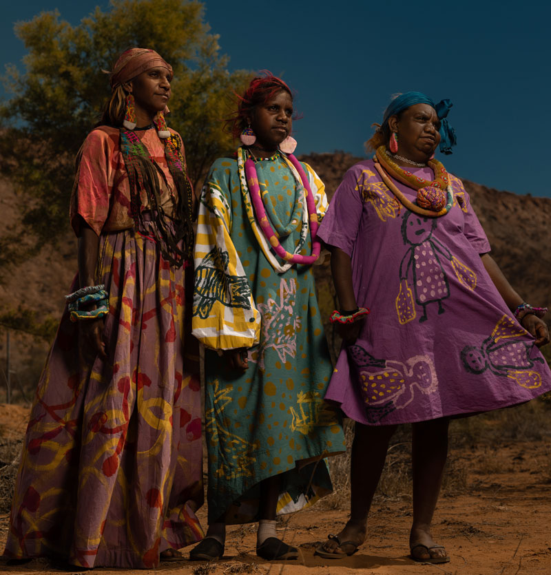 Lekita Malbunka, Helen Ebatarinja and Sheree Inkamala modelling for Yarrenyty Arltere fashion shoot, 2019. © Maurice Petrick, Cornelius Ebatarinja, Quincy Stevens, Dennis Brown, Desart and Yarrenyty Arltere Artists 