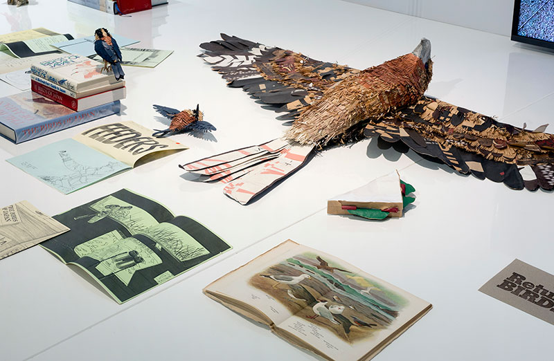 Raquel Ormella Bird Hunter, 2004-2018 (detail) objects from the artist’s collection: books, field guides, zines, stamps, paper binoculars, ceramic and paper birds, drawings. objects from SAM’s ceramics collection. dimensions variable, courtesy the artist and Milani Gallery, Brisbane © the artist. Photo: Christian Capurro