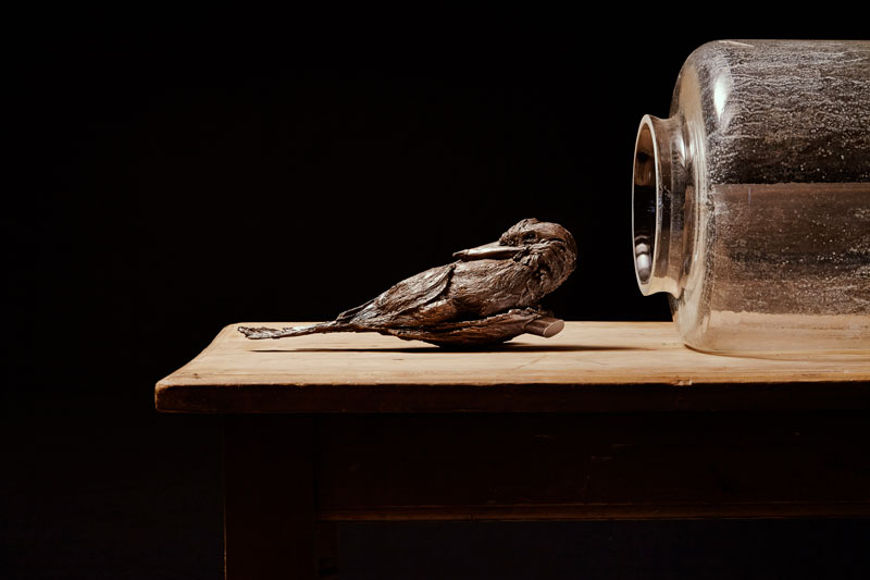 Louiseann King, arbor temporis momentum – recedo, 2017, bronze, vintage glass vessels, early Australian colonial kauri pine table, vintage wool crochet baby blanket, vintage glass panels. Photo: Danny Wootton