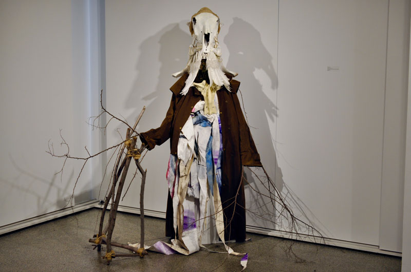 Travis de Vries, The Storyteller, 2019, bone, dryzabone, moss, wood, jute twine, ink, oil paint, manikin. Courtesy the artist