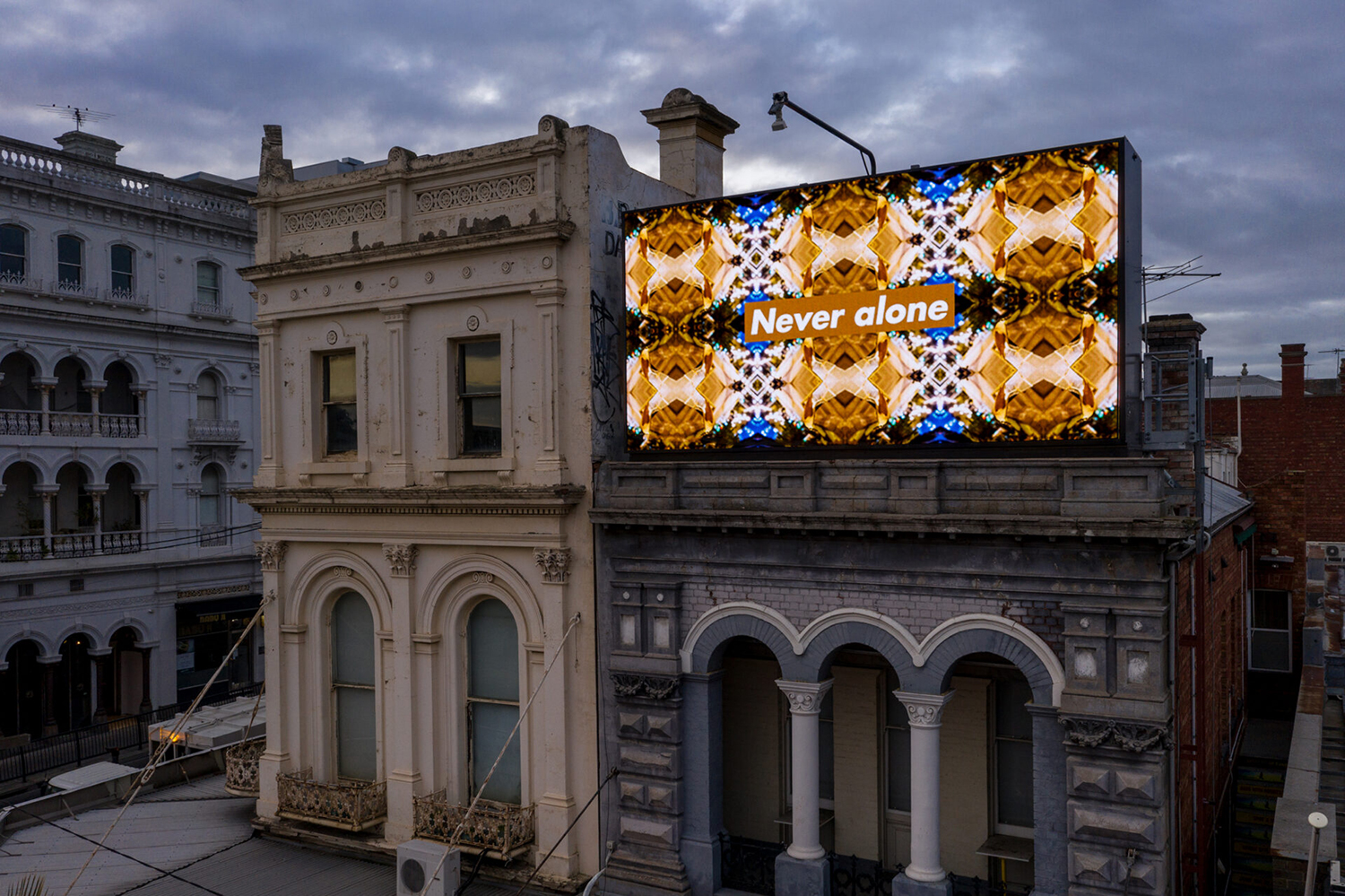 Kent Morris, Never alone 2020, digital billboard, installation image, intersection of Fitzroy Street, Canterbury Road and Grey Street, St Kilda, Melbourne. Commissioned by ACCA. Courtesy the artist. Photograph: Andrew Curtis